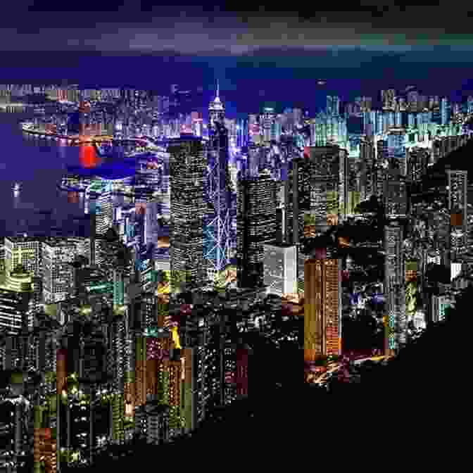 A Breathtaking And Iconic View Of The Hong Kong Skyline At Night, Featuring The Glittering Lights Of Skyscrapers And The Vibrant Harbor Hong Kong Travel Guide (Unanchor) Between The Skyscrapers Hong Kong 3 Day Discovery Tour